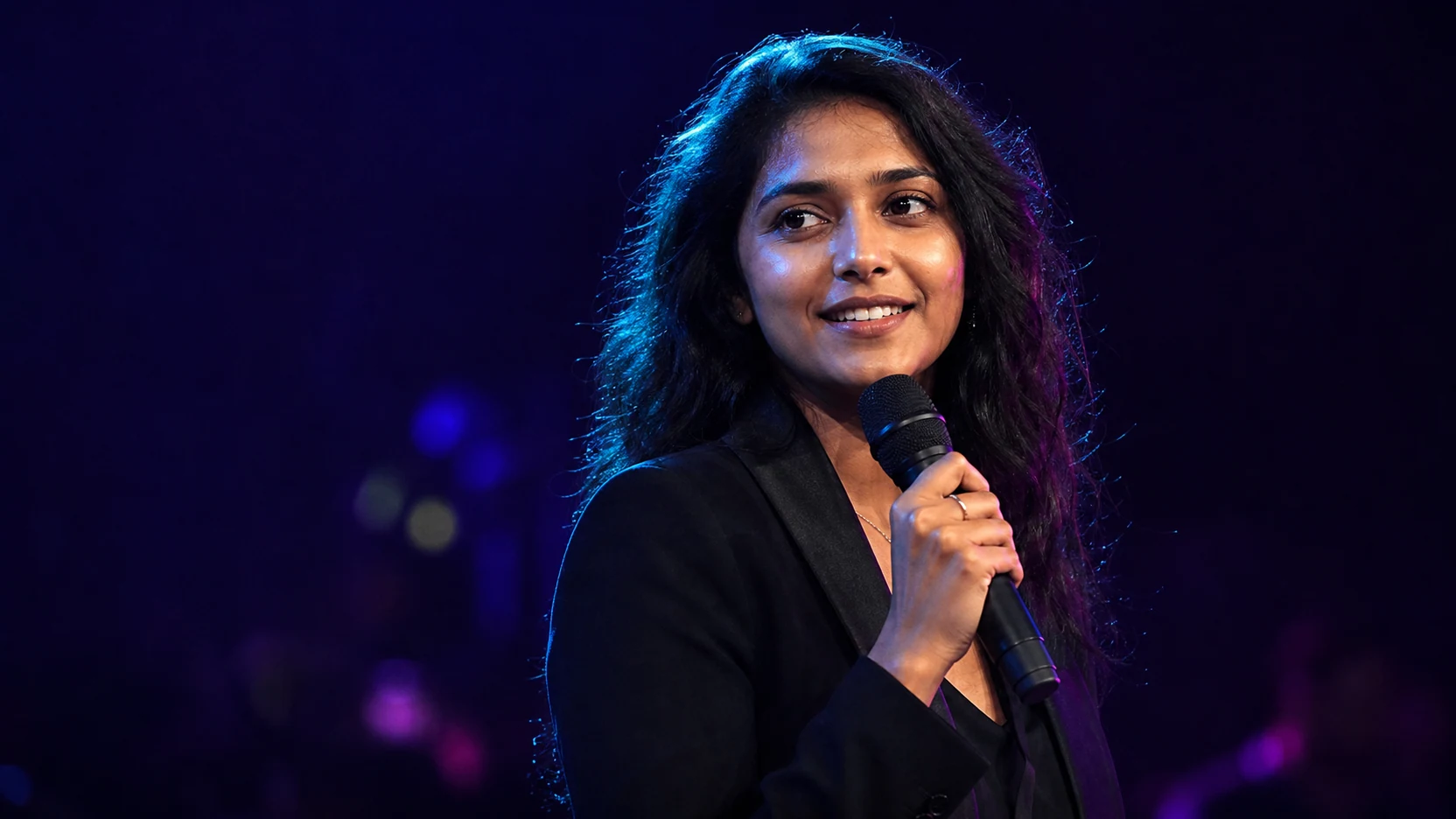 Young Indian performer in cinematic neon light